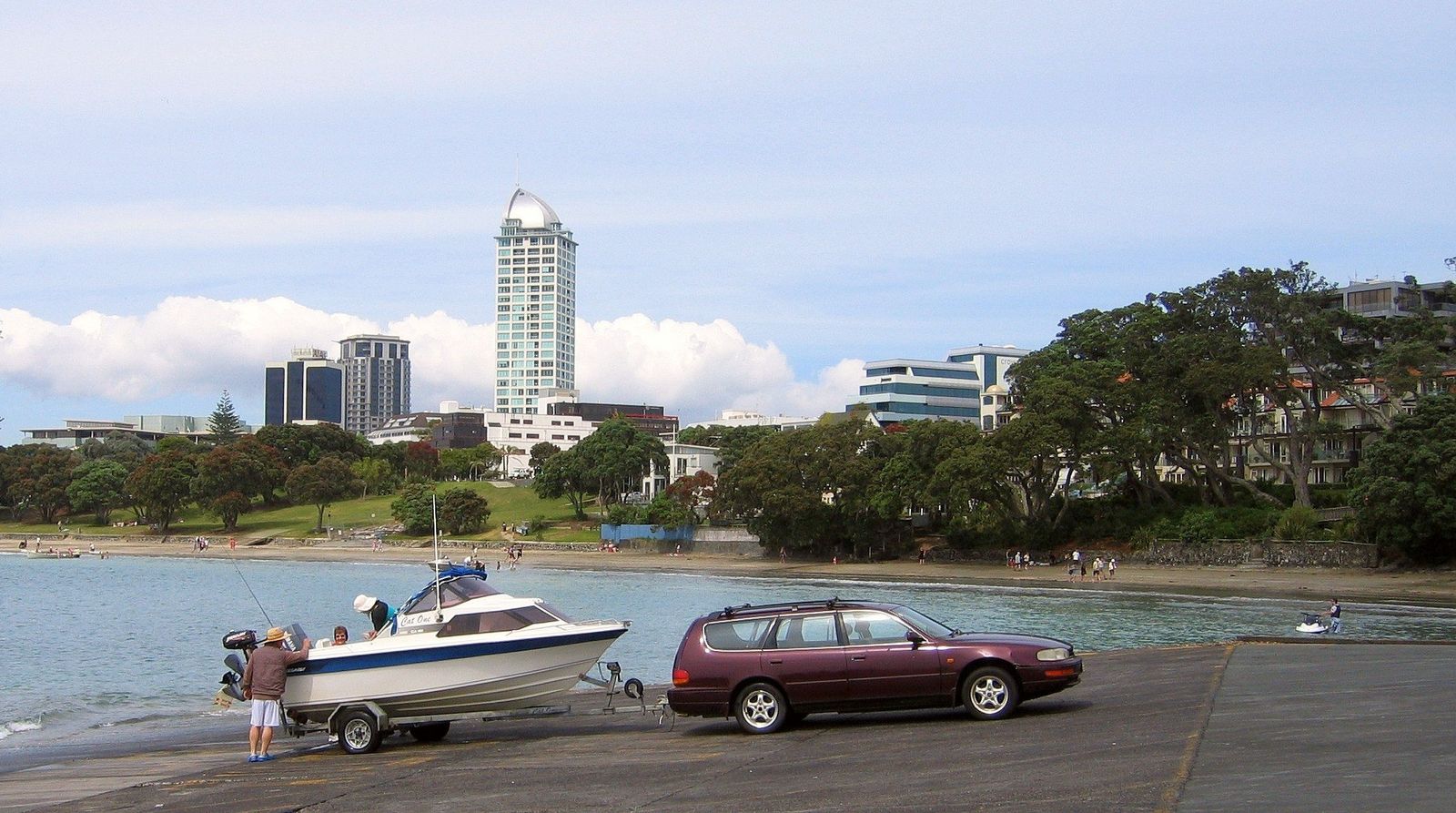 A family trailer boat being launched at the Takapuna Beach boat ramp