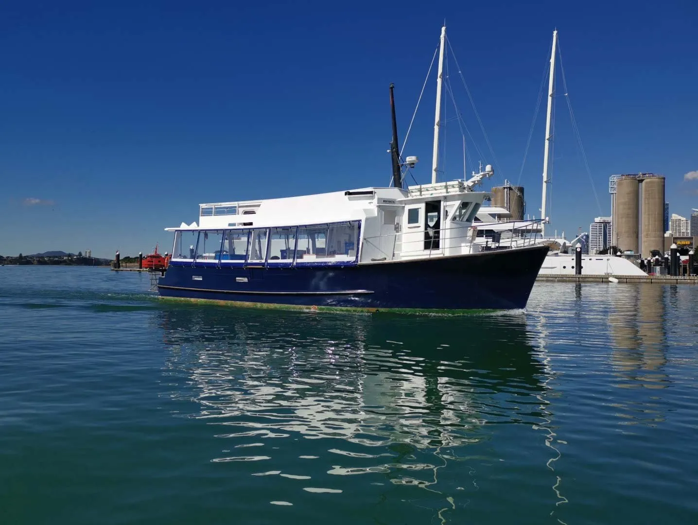 MV Koru, Ultimate Charters' launch, on the Waitematā Harbour