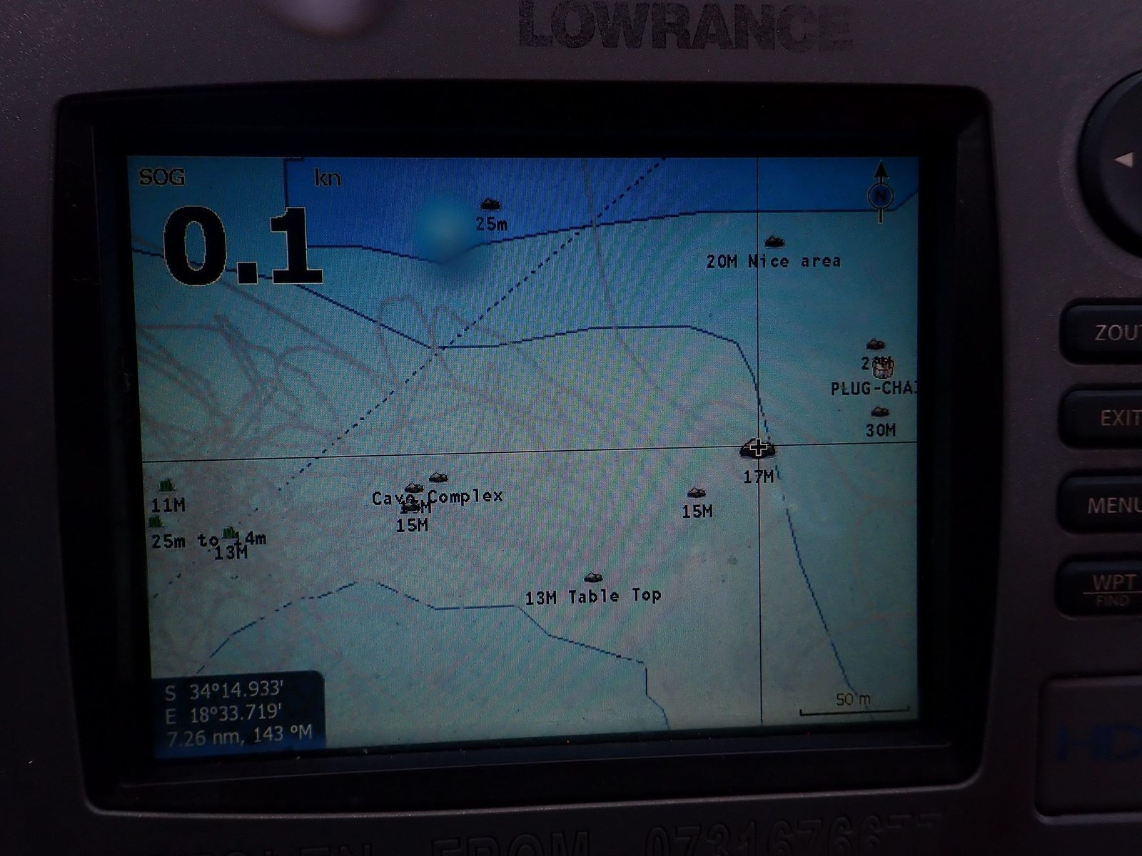 A fish finder and chartplotter screen showing depth marks over a reef