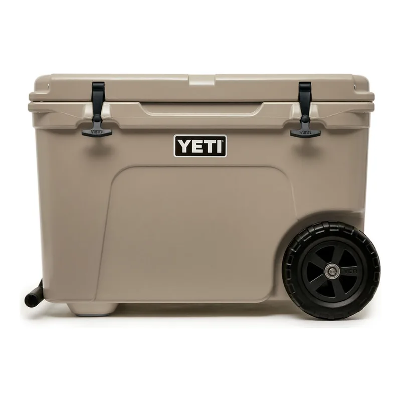 Tan YETI Tundra Haul rotomoulded chilly bin on two black wheels with a pull handle